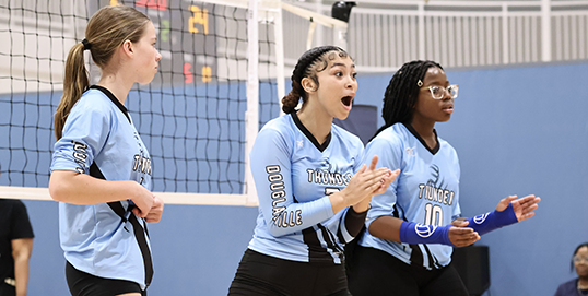 Girls playing youth volleyball