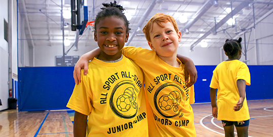 Kids in bright yellow All Star All Sport Jr. t-shirts