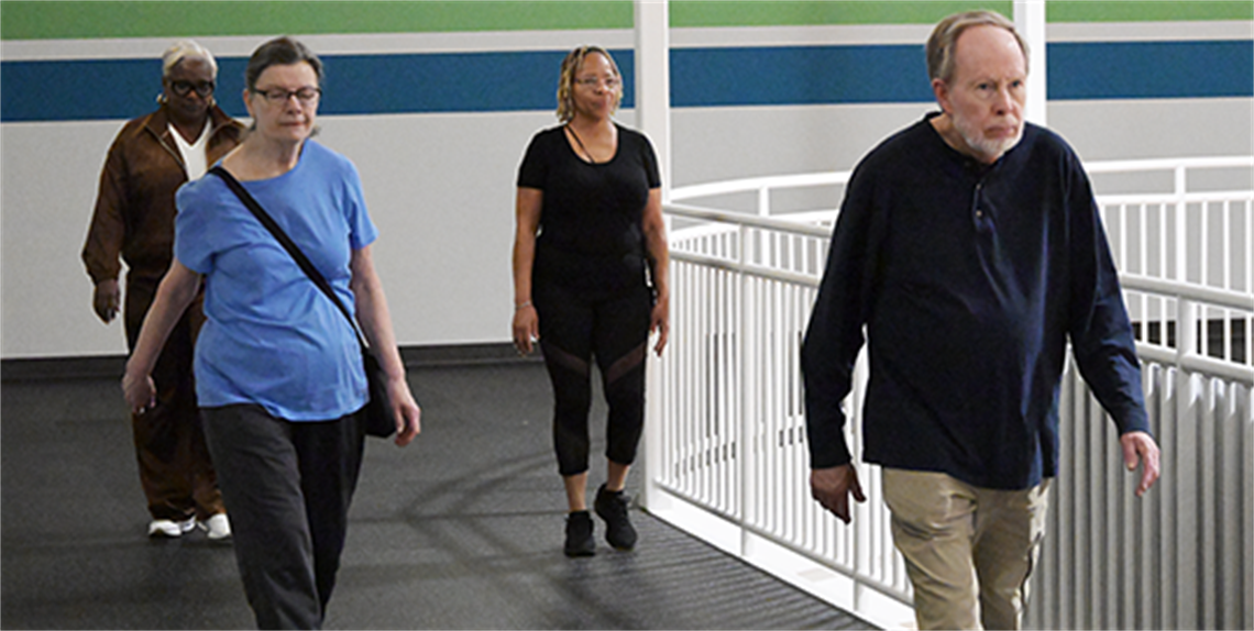 Silver Step Walking Club participants walking the Jessie Davis Indoor Track