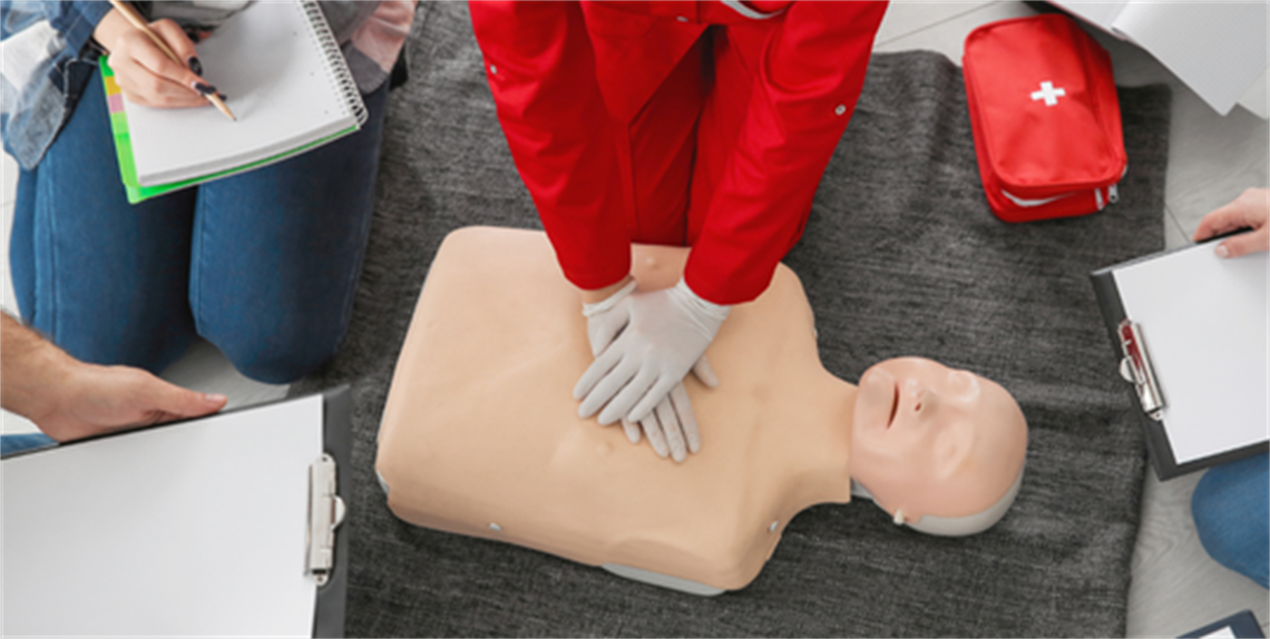 Performing CPR on a training mannequin
