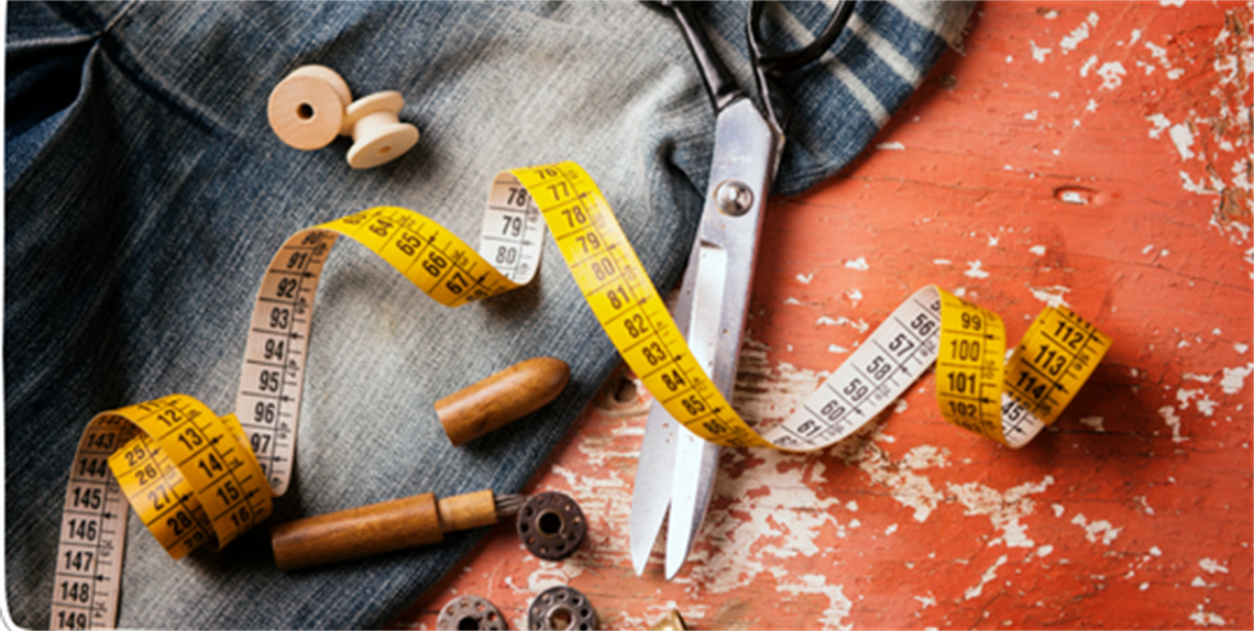 Various tools for sewing on cloth background