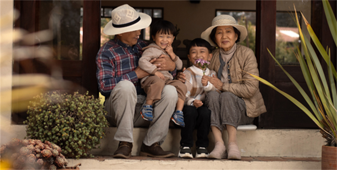 Elderly Asian couple with 2 grandchildren