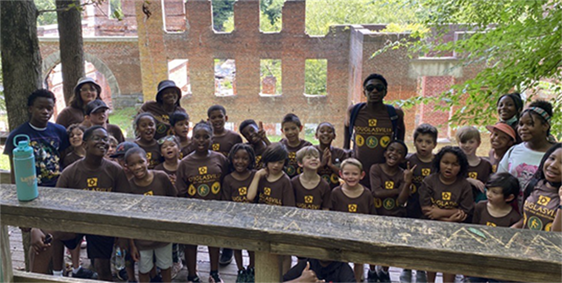 Junior Ranger Campers group photo in front of Sweetwater Creek Ruins