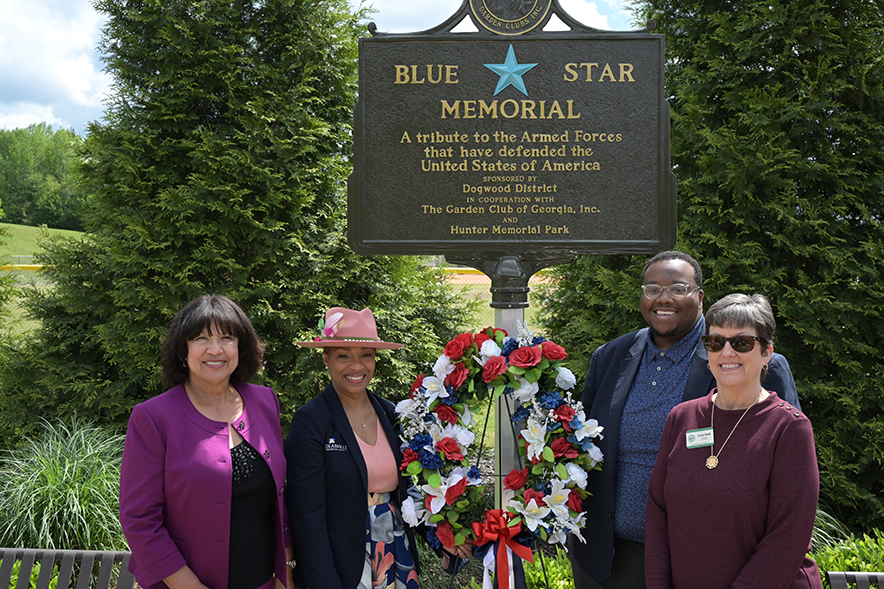 Mayor-Parks Dir-Garden club members at the Blue Star Memorial