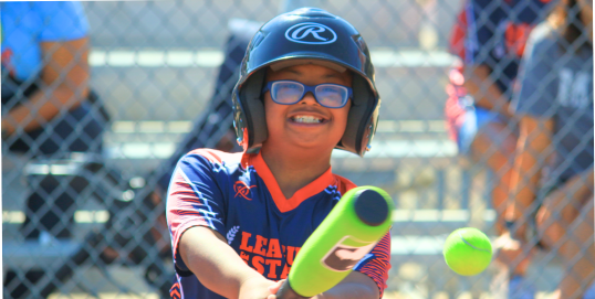 Batter in Wheelchair swings at a pitch 